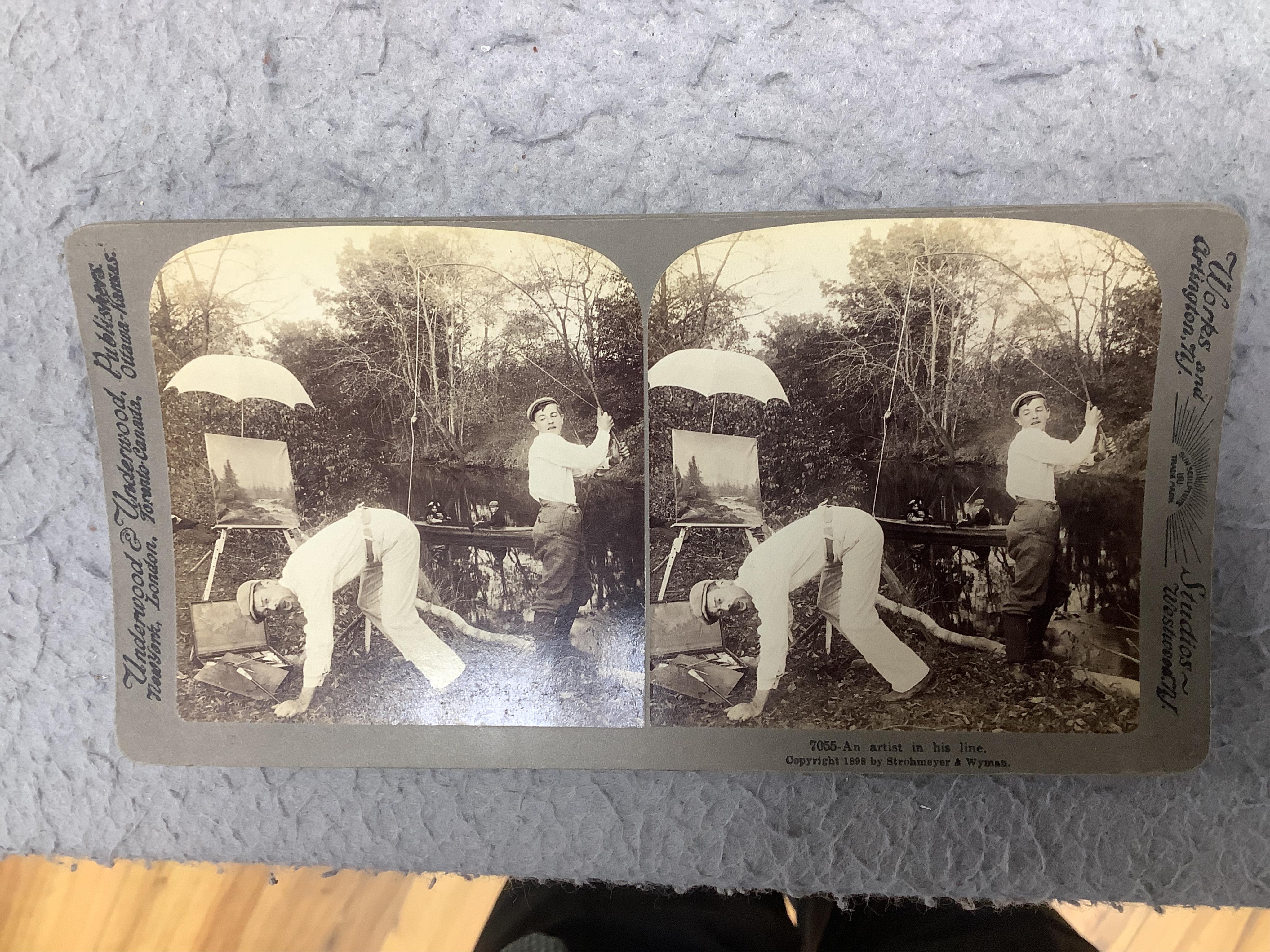 A stereoscope viewer with a collection of comical viewing cards. Condition - cards - fair/good, viewer - poor